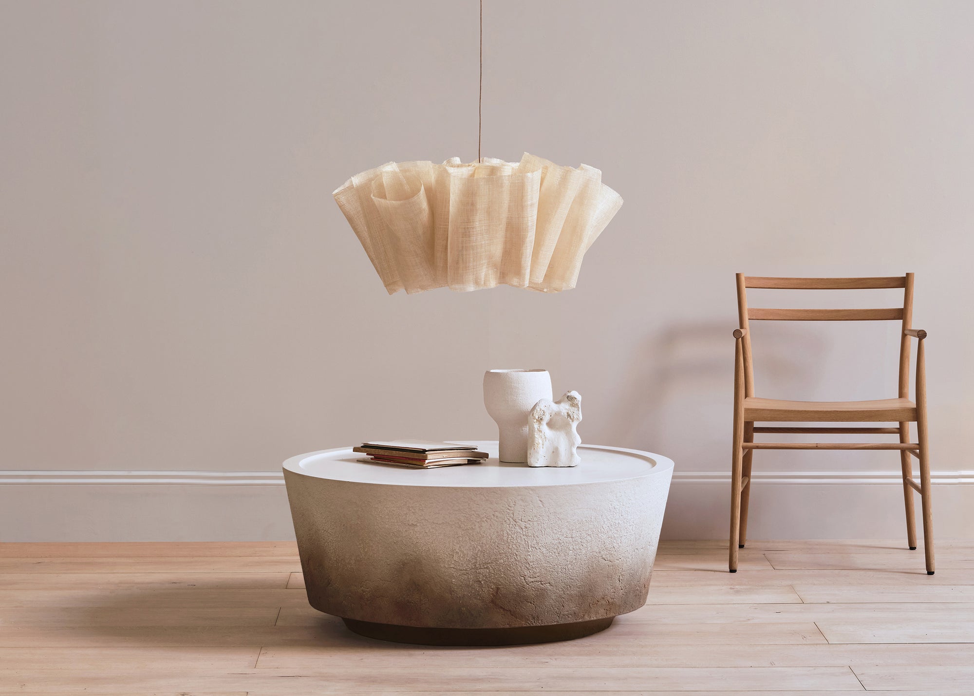 Nim Dune coffee table with Anders light large and Avery armchair by PINCH