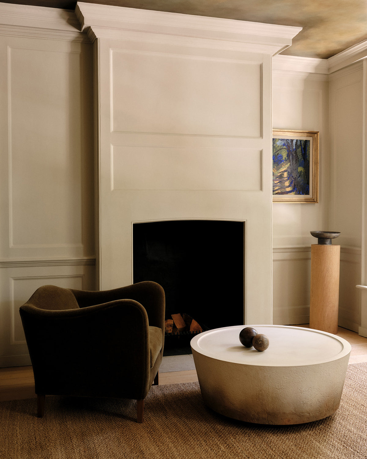 moreau-armchair-nim-dune-fireplace