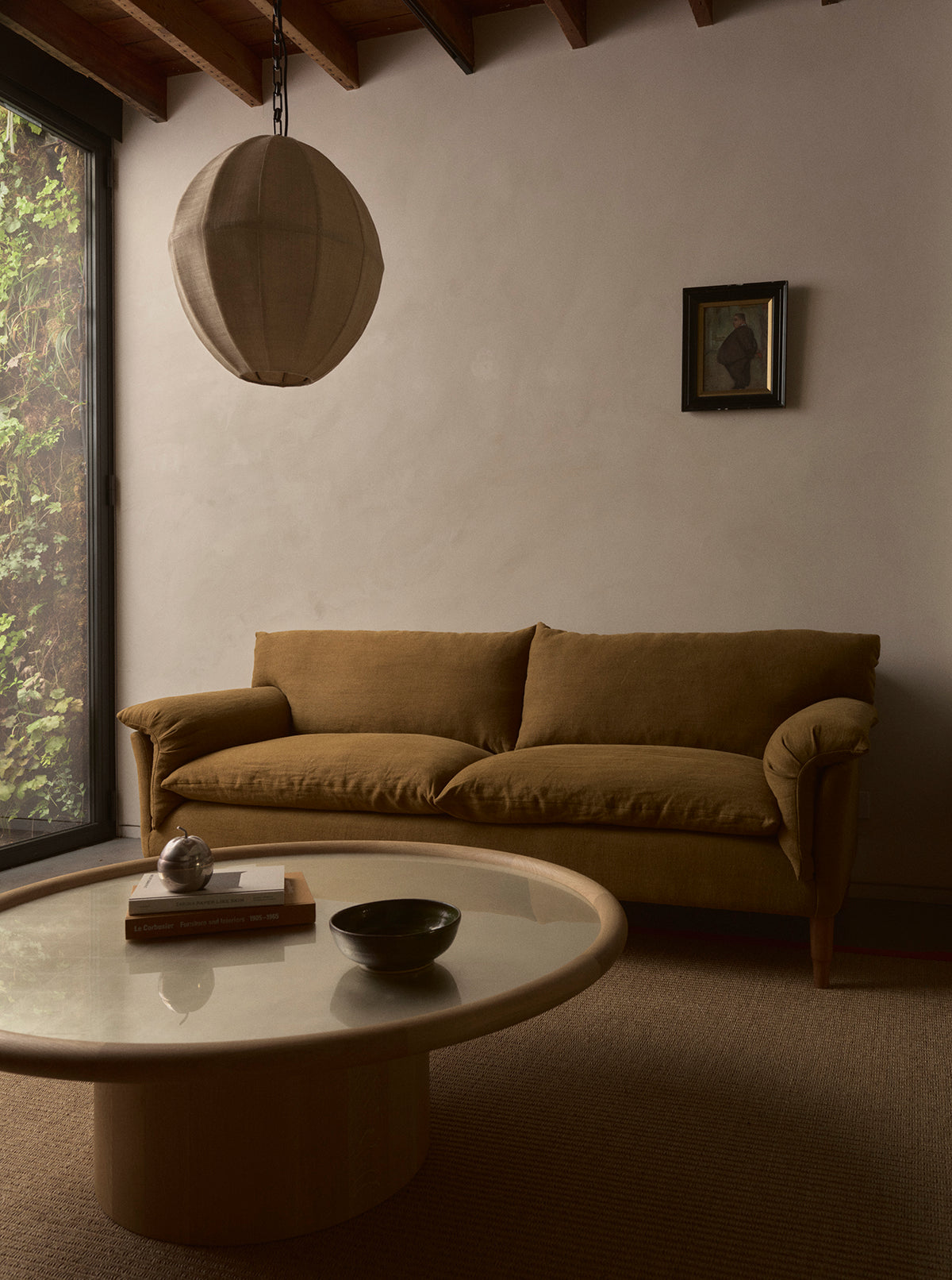 Rydal sofa with Pium pod pendant light and Landry coffee table white gold circular
