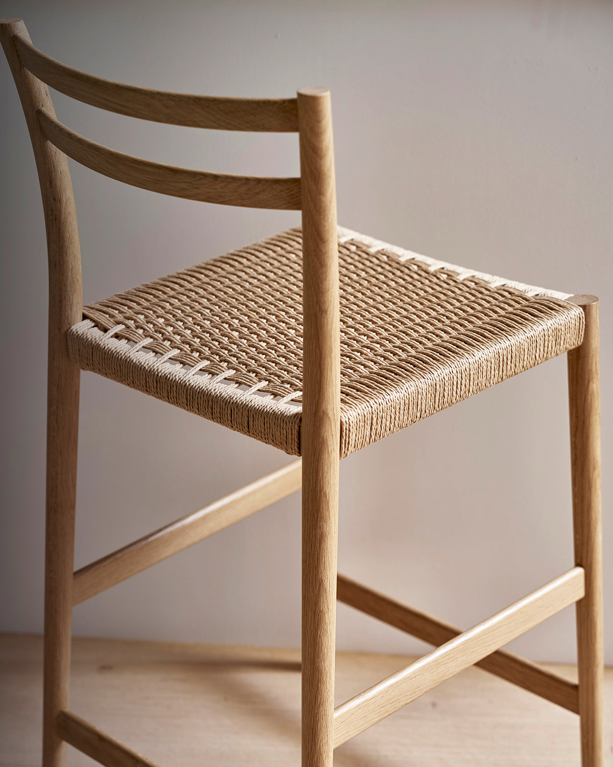 Avery woven counter stool